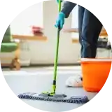 map cleaning floor with a mop stick and bucket of water