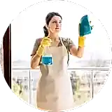 girl spraying cleaning on glasses and cleaner with a wiper