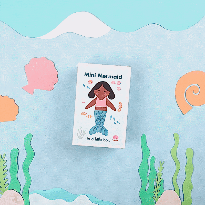 A stop motion video of a mermaid toy swimming out of a box