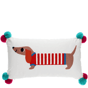 White cushion featuring a printed sausage dog design and tassels