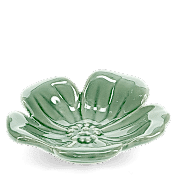 A green, flower-shaped ceramic trinket dish