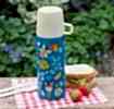 Small dark blue stainless steel flask with cream plastic cup featuring fairies amongst flowers
