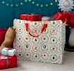 Christmas storage bag with classic designs, filled with presents