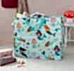 large rectangular bag with a light blue background, featuring colourful mermaid print