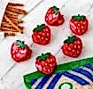 Six strawberry-shaped bag clips in red with green leaves