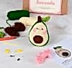 Avocado crochet kit with packaging and finished crocheted avocado beside it