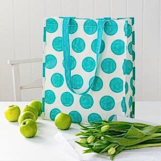 Recycled plastic shopping bag turquoise circles cream background