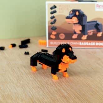 completed sausage dog model kit with the packaging