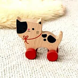 wooden push-along cat toy with red wheels