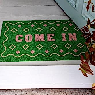 doormat featuring come in print with green background