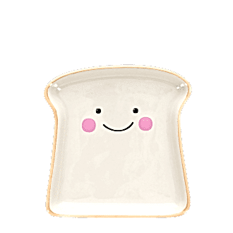 Ceramic trinket dish shaped like a slice of bread with a smiling face and pink cheeks