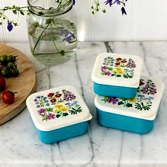 Three plastic snack boxes in turquoise and cream featuring floral pattern