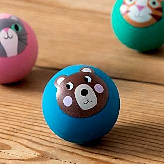 Blue bouncy ball with a bear face design