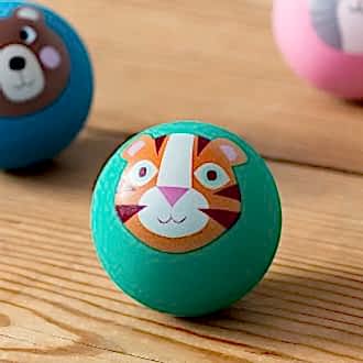 Green bouncy ball with a tiger face design