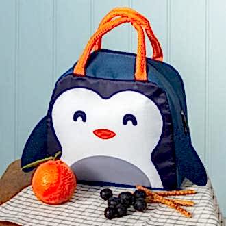 Navy blue lunch bag with orange handles and a cute penguin face design on the front and a black wings on each side