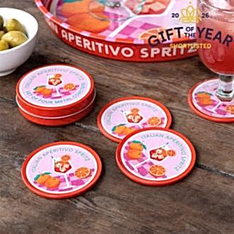 Four round coaster with Italian Aperitivo Spritz design in a storage tin