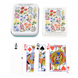 Standard deck of playing cards with print of wild flowers on white background on backs plus metal tin