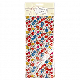 Tilde tissue paper sheets in packaging