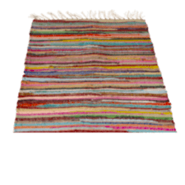 Multicoloured handloomed cotton rug laid flat