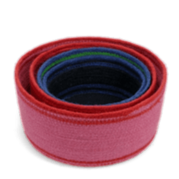 Stacked woven storage baskets in varying sizes and colours