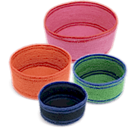 Four woven storage baskets in varying sizes and colours