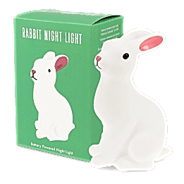 Rabbit-shaped battery-powered night light with pink ears, placed next to packaging box