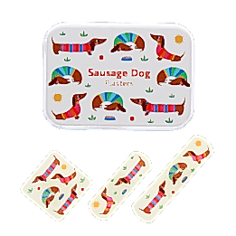 Sausage dog-printed plasters placed beside a matching storage tin featuring sausage dog illustrations