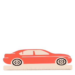 A red ruler shaped like a car with measurement markings along the bottom edge