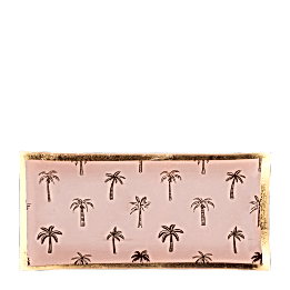 Rectangular trinket dish with gold rim and palm tree pattern on a pink background