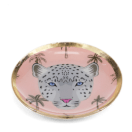 Round trinket dish with gold rim, pink background, palm tree pattern, and a leopard face design