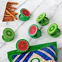 Six round bag clips shaped like kiwi and watermelon slices in green and red
