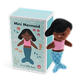 Mini mermaid soft toy placed beside a small illustrated box with mermaid design