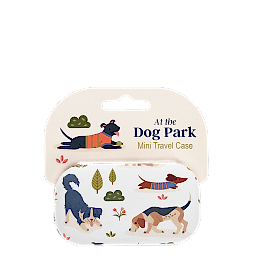 Mini travel case with playful illustrated dogs and trees on a light background
