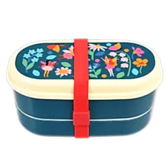 Dark blue kids bento box with cream lid and middle tray plus red elastic strap featuring print of fairies amongst flowers