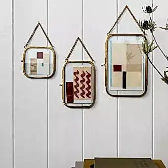 Rounded hanging brass frame