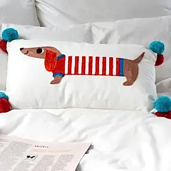 Embroidered cushion with pom poms - Sausage Dog