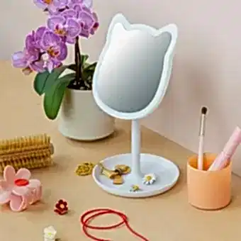 Cat-shaped LED vanity mirror on a stand with accessories