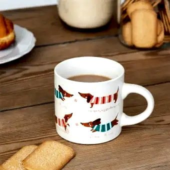 Ceramic mug with a cute sausage dog illustration