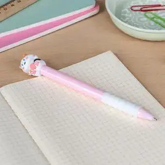 Retractable ballpoint pen in pink showing a cute cat sitting atop