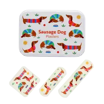Sausage dog-printed plasters placed beside a matching storage tin featuring sausage dog illustrations