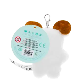 back of Yeti-shaped plush keyring and a tag showing safety warnings
