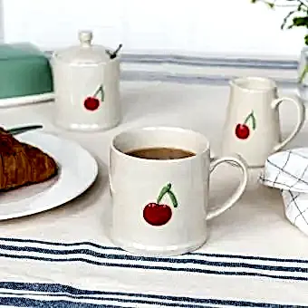 Stoneware mug featuring cherry print with handle 