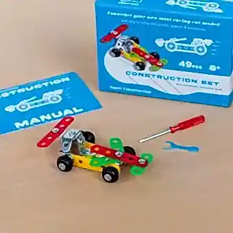 Completed colourful racing car model displayed with its packaging box
