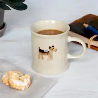 Stoneware mug featuring a dog with handle