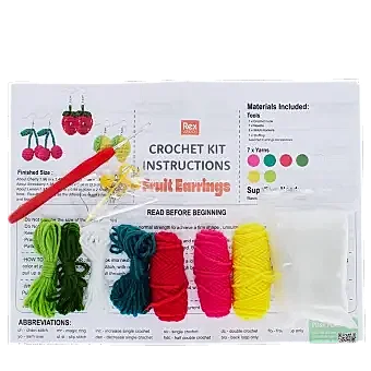 Crochet earring kit with yarns, hook, needle, stuffing, and instructions to make fruit-shaped earrings
