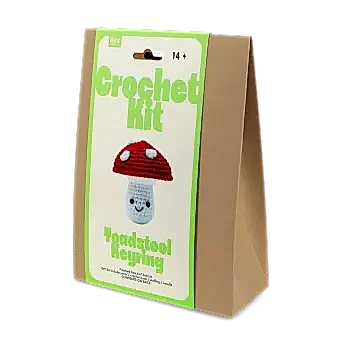 Crochet kit front packaging with printed toadstool design