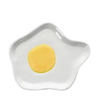 White ceramic trinket dish shaped like a fried egg with yellow yolk design