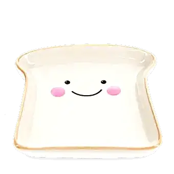 Ceramic trinket dish shaped like a slice of bread with a smiling face and pink cheeks