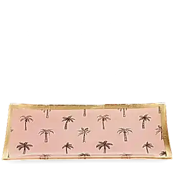 Rectangular trinket dish with gold rim and palm tree pattern on a pink background