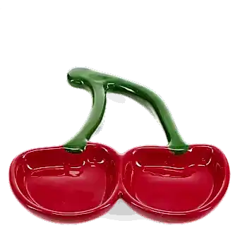 Red ceramic trinket dish shaped like two cherries with green stems.